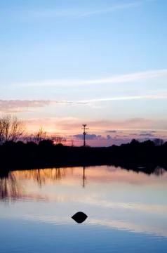Lake at sunset Stock Photos