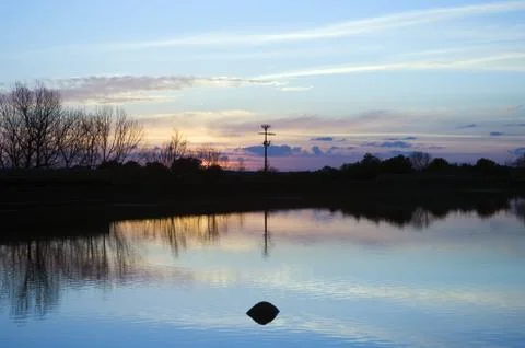 Lake at sunset Stock Photos