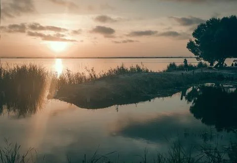 Lake with sunset Stock Photos