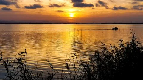 Lake with sunset Stock Photos