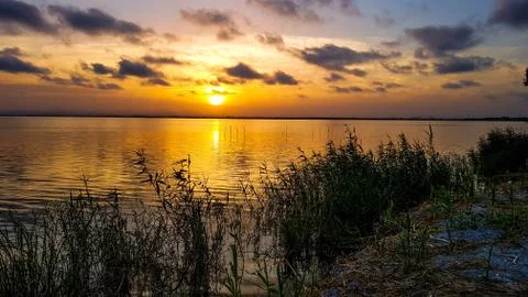 Lake with sunset Stock Photos