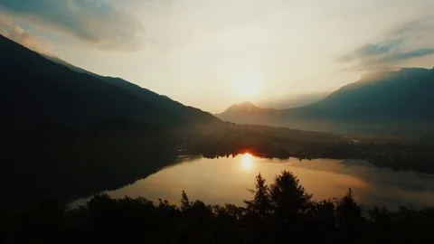 Lake sunset view. magic hour. golden dusk sky. aerial view. Levico, Italy. Stock Footage 93418870