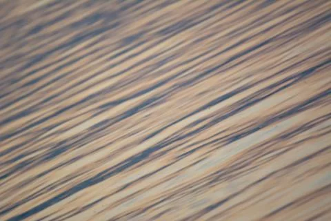 Lake surface pattern at sunset with blue and pink colors Stock Photos