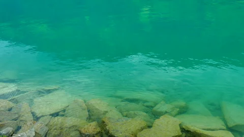 Lake Surface in the Swiss Alps Видео 330632590