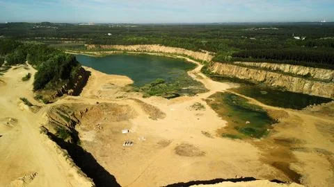 Lake Surrounded by a Dolomite Quarry – Drone View A striking drone-captured imag Stock Photos