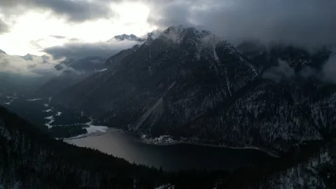 Lake surrounded by mountains 2 Stock Footage 237776616