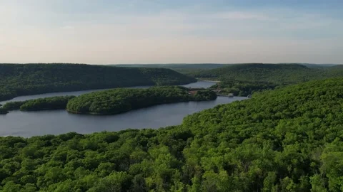 Lake surrounded by Mountains in 4K Stock Footage 195542538