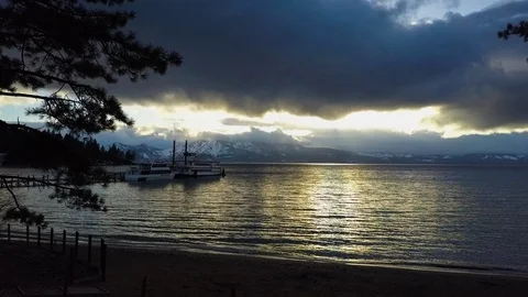 Lake Tahoe, drone moving towards ferry and boat at sunset Stock Footage