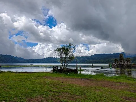 Lake Tamblingan under a dramatic cloudy sky in Bali, Indonesia Stock Photos