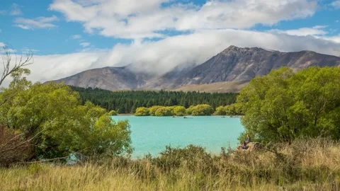 Lake Tekapo with clouds rolling over mountainrange,4k,timelapse Stock Footage 229716968
