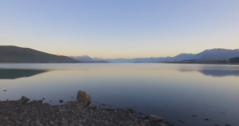 Lake Tekapo with mountain range in background at dusk Stock Footage 119165004