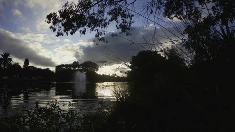 Lake Timelapse cloudy sky sunset landscape And waterside silhouette HDR Stock Footage 253871443