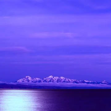 Lake titicaca and the andes at full moon Stock Photos