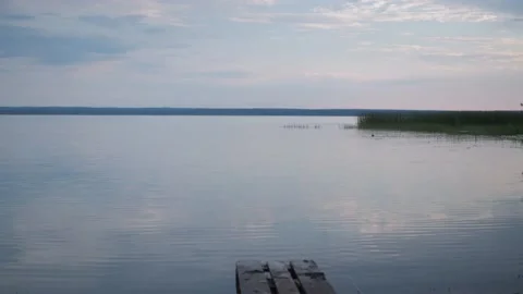 Lake tranquility. a small wave on the water. the soft light from the setting sun Stock Footage 170822558