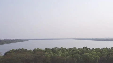 Lake with trees pan left to right 50fps Stock-Footage 247402570