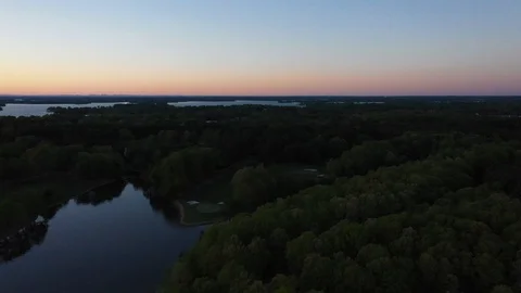 Lake an trees view at sunset Stock Footage 107674754