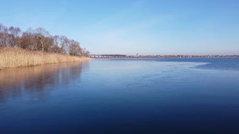 Lake under blue cloudy sky aero Stock Footage 122946822