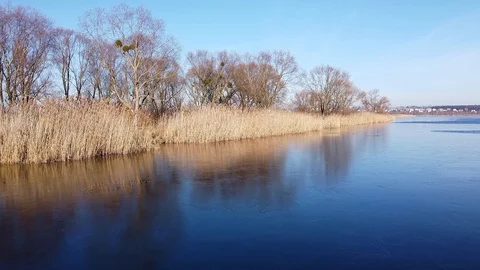 Lake under blue cloudy sky aero Stock Footage 122946903