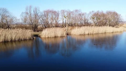 Lake under blue cloudy sky aero Stock Footage 122947504