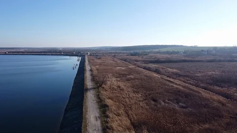 Lake under blue cloudy sky aero Stock Footage 122947651