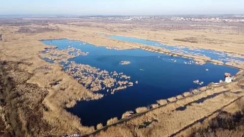 Lake under blue cloudy sky aero Stock Footage 122947787