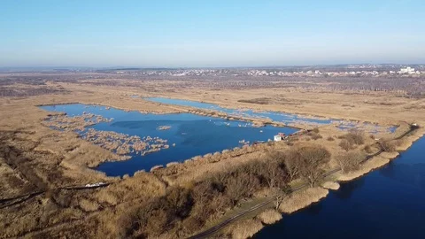 Lake under blue cloudy sky aero Stock Footage 122948396