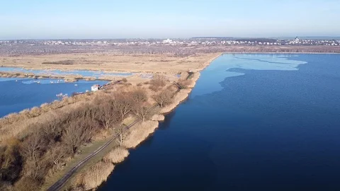 Lake under blue cloudy sky aero Stock Footage 122949210