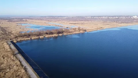 Lake under blue cloudy sky aero Stock Footage 122949368