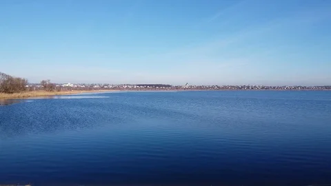 Lake under blue cloudy sky aero Stock Footage 122949719