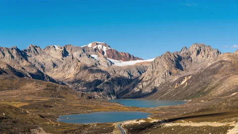 Lake under snow mountains, cloud shadow moving Video stock 161450072