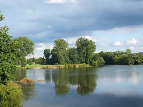 A lake under stormy clouds Stock Photos