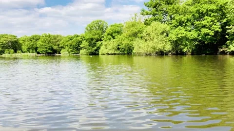 Lake view with blue sky reflection on water, England. Stock Footage 130443815