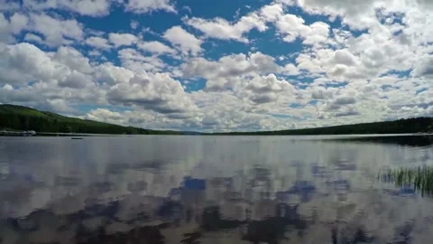 Lake view over blue sky with clouds Stock Footage 164907895