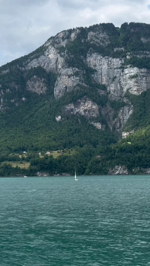 Lake Walen Walensee edge surrounded by steep mountains Switzerland vertical Видео 331617021