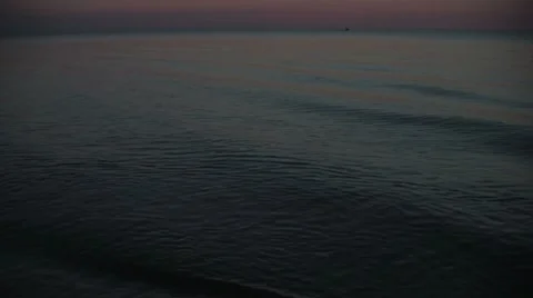 Lake waves at dusk Stock Footage 7762590