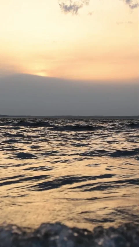Lake waves in the sunset rays Stock Footage 273586633