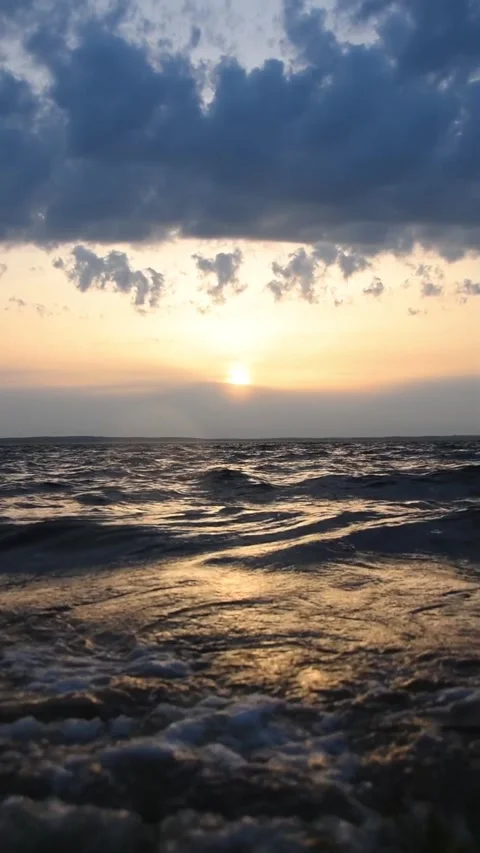 Lake waves in the sunset rays Stock Footage 273586694