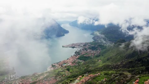 Lake's dramatic reveal behind clouds with drone Video stock 234403858