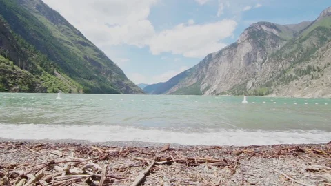 Lakeshore waves with mountain backdrop Stock Footage 110627953