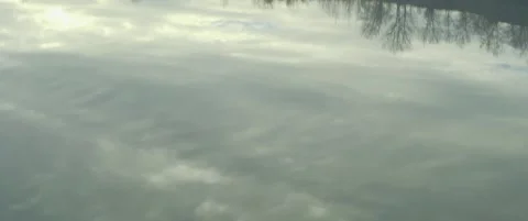 Lakeside and clouds reflections on beautiful lake 5.7K anamorphic video Stock Footage 300541084