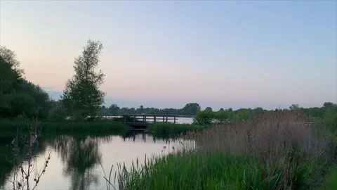 Lakeside with bridge at sunset. Stock-Footage 241612653