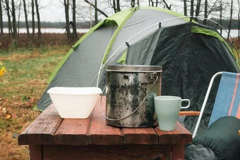 Lakeside camping scene, Camp setup by tranquil waters, Arranged campsite area Stock Photos