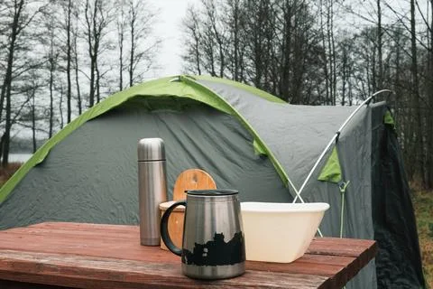 Lakeside camping scene, Camp setup by tranquil waters, Arranged campsite area Stock Photos