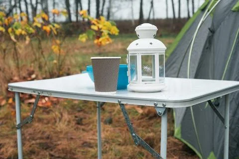 Lakeside camping scene, Camp setup by tranquil waters, Arranged campsite area Stock Photos