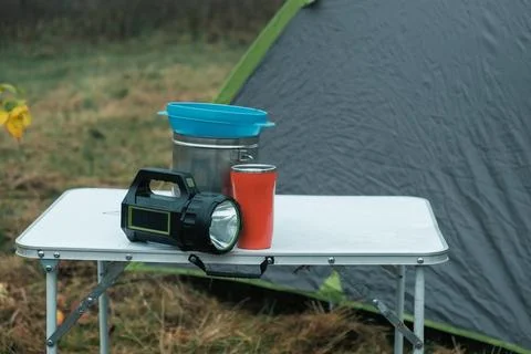 Lakeside camping scene, Camp setup by tranquil waters, Arranged campsite area Stock Photos