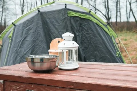 Lakeside camping scene, Camp setup by tranquil waters, Arranged campsite area Stock Photos