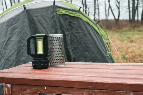 Lakeside camping scene, Camp setup by tranquil waters, Arranged campsite area Stock Photos
