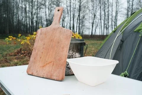 Lakeside camping scene, Camp setup by tranquil waters, Arranged campsite area Stock Photos