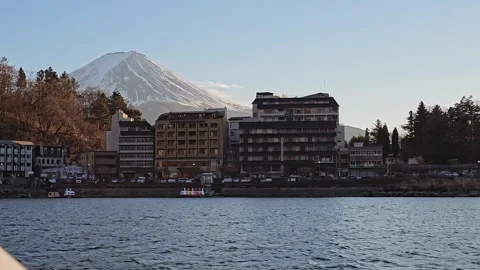 Lakeside hotels below Mount Fuji on Lake Kawaguchi, Fujikawaguchiko, Yamanashi, Stock Footage 344532370