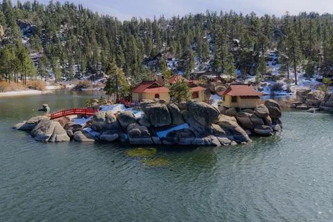 Lakeside Resort with Boulder Architecture in Pine Forest Stock Photos